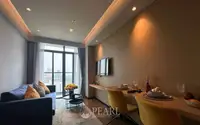1 Bedroom Condo for Sale at Beverly Mountain Bay Pattaya open-plan living and dining room with floor-to-ceiling windows and city view
