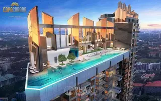 Copacabana Coral Reef rooftop infinity pool with sun loungers and a modern high-rise building exterior.