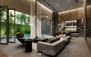 Baan Mae Residence 69 spacious living room with high ceilings, large windows, and contemporary furniture.