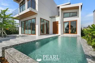 Atmos Prime: Modern white house exterior with private swimming pool and wooden framed glass doors.
