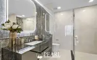 2 Bedroom Condo for Sale at Aquarous Jomtien Pattaya luxury bathroom with marble vanity, LED mirror and glass walk-in shower