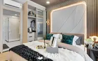 2 Bedroom Condo for Sale at Aquarous Jomtien Pattaya bedroom with built-in wardrobe, en-suite glass shower and accent lighting