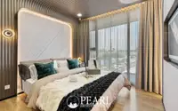 2 Bedroom Condo for Sale at Aquarous Jomtien Pattaya master bedroom with LED backlit headboard and floor-to-ceiling windows