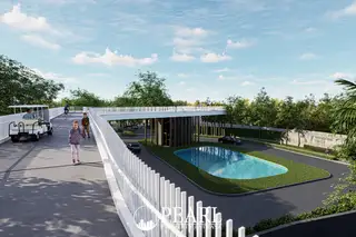 Wisdom First Residences elevated walkway and main entrance with a decorative pond and lush landscaping.