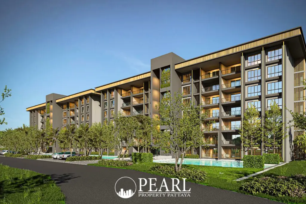 Zensiri Estates and Residences modern condo building with balconies, lush landscaping, and a swimming pool.