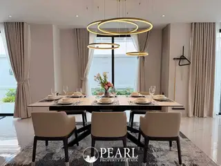 View Point Village contemporary dining room with large table, chairs, and modern chandeliers.