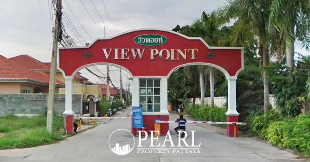 View Point Village main entrance gate with red archway and security booth.