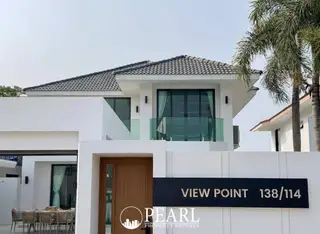 View Point Village modern white house exterior with wooden door and glass balcony.