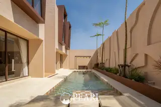 Villa Barrera: Modern exterior with a rectangular swimming pool, sun loungers, and a bedroom visible through glass doors.