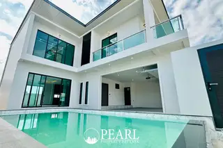 Jin Village modern white house with a private swimming pool, large windows, and an open carport.