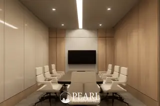 Baan Mae 12 – Onyx Grand Village modern conference room with a large table, white chairs, and wall-mounted TV.