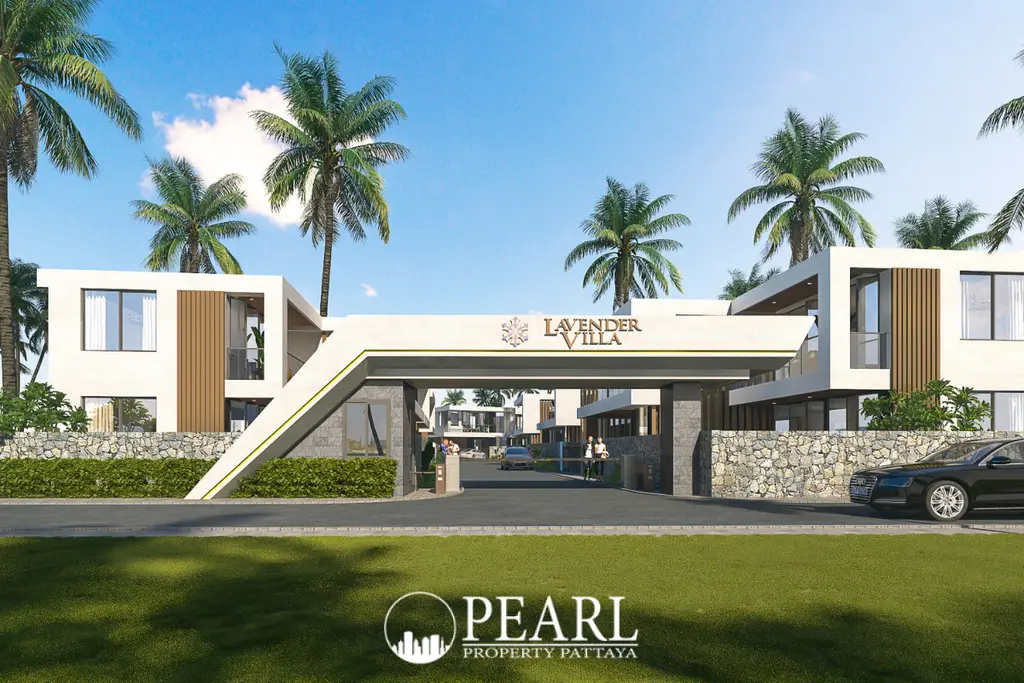 Lavender Villa main entrance gate with modern architecture, palm trees, and stone walls under a blue sky.