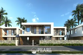 Lavender Villa modern white house exterior with large windows, balconies, palm trees, and stone wall fence.
