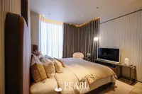 2 Bedroom Condo for Sale in Arom Jomtien master bedroom with king-size bed