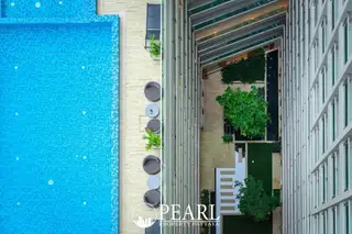 The Cloud aerial view of the outdoor swimming pool and the building's interior courtyard garden.