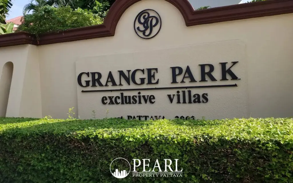 Grange Park Villa entrance sign for exclusive villas in Pattaya, Thailand, with green hedges.