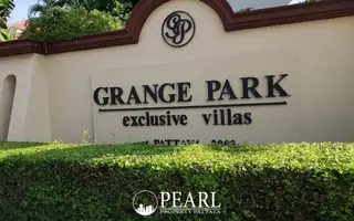 Grange Park Villa entrance sign for exclusive villas in Pattaya, Thailand, with green hedges.