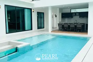 Castle Hill contemporary house with pool, two cars in driveway, and mountain backdrop.