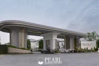 The Palm Pattaya Chaiyapornvitee 25 grand entrance gate with modern archway, security booth, and cars.