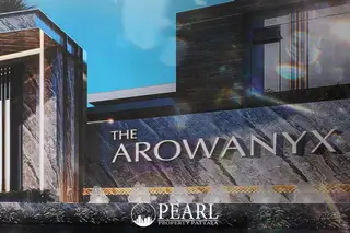 The Arowanyx entrance sign, a large stone slab with 'THE AROWANYX' carved into it.