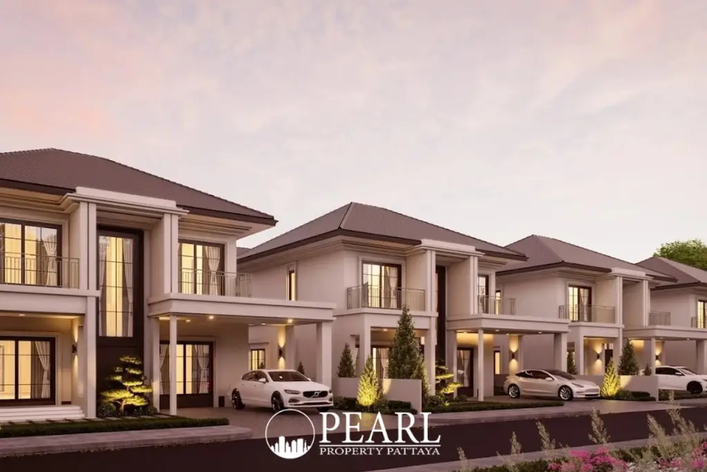 Serene Home: Row of modern white houses with dark roofs and cars in driveways at dusk.