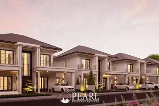 Serene Home: Row of modern white houses with dark roofs and cars in driveways at dusk.