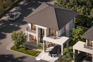 Serene Home: Aerial view of a modern white house with a dark roof, carport, and green landscaping.