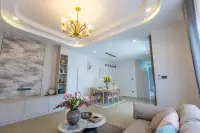 3 Bedroom House for Sale at Phonthep Garden Ville 2 dining room with large wood table eight chairs and pendant lights