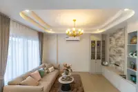 3 Bedroom House for Sale at Phonthep Garden Ville 2 close-up of beige sofa with cushions and marble-top coffee tables on rug