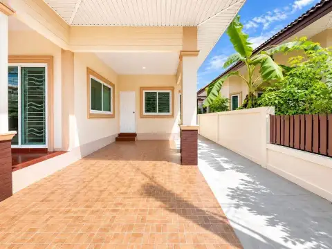 3 Bedroom House for Rent at PMC Home 4 covered side walkway and carport leading to entrance with tropical plants