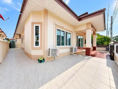 3 Bedroom House for Rent at PMC Home 4 side exterior with tiled walkway and air conditioning units