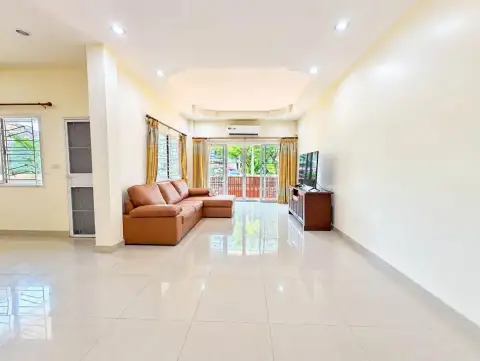 3 Bedroom House for Rent at PMC Home 4 spacious living room with leather sectional sofa and TV console