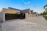 3 Bedroom House for Sale in Pong entrance gate and driveway within gated community at sunset