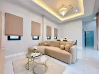3 Bedroom House for Sale in Pong bright living room with beige sofa, marble floor and crystal chandelier