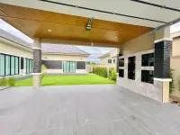 3 Bedroom House for Sale in Pong spacious carport with wood-paneled ceiling overlooking green lawn