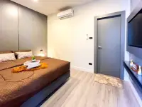 3 Bedroom House for Sale in Mabprachan bedroom with wood flooring, wall-mounted TV, and air conditioner