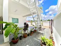 3 Bedroom House for Rent in Mabprachan side walkway with potted plants and staircase to rooftop