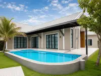 4 Bedroom House for Rent in Mabprachan exterior with private pool, lawn and palm trees