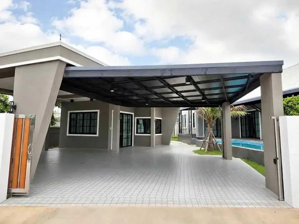 4 Bedroom House for Rent in Mabprachan covered carport driveway with pool view in the background