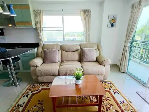 1 Bedroom Condo for Rent at Porch Land 2 beige sofa with balcony window and city view
