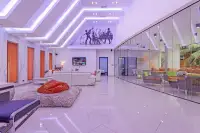 4 Bedroom House for Sale & Rent in Pratumnak Hill open-plan living area with jazz mural ceiling, glass partition wall, and polished white tile floors
