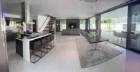 7 Bedroom House for Sale & Rent in Pratumnak Hill open-plan kitchen, dining and living space with staircase and pool access