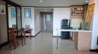 1 Bedroom Condo for Sale at Prime Suites hallway with dining table, mirrored wall and artwork near entrance