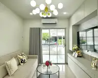 3 Bedroom House for Sale in East Pattaya living room with gray sofa, glass coffee table, and gold chandelier