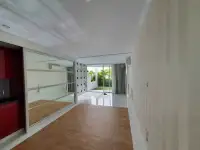 1 Bedroom Condo for Sale at Pure Sunset Beach hallway view with mirrored closet and natural light from balcony