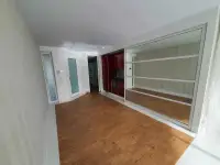 1 Bedroom Condo for Sale at Pure Sunset Beach entryway with wood flooring, red cabinetry and mirrored sliding door