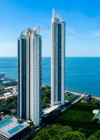 3 Bedroom Condo for Sale at Reflection Jomtien Beach aerial view of twin high-rise towers along the coastline