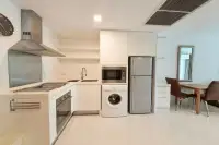 2 Bedroom Condo for Sale & Rent at The Sanctuary Wongamat fully equipped kitchen with oven, washing machine and refrigerator