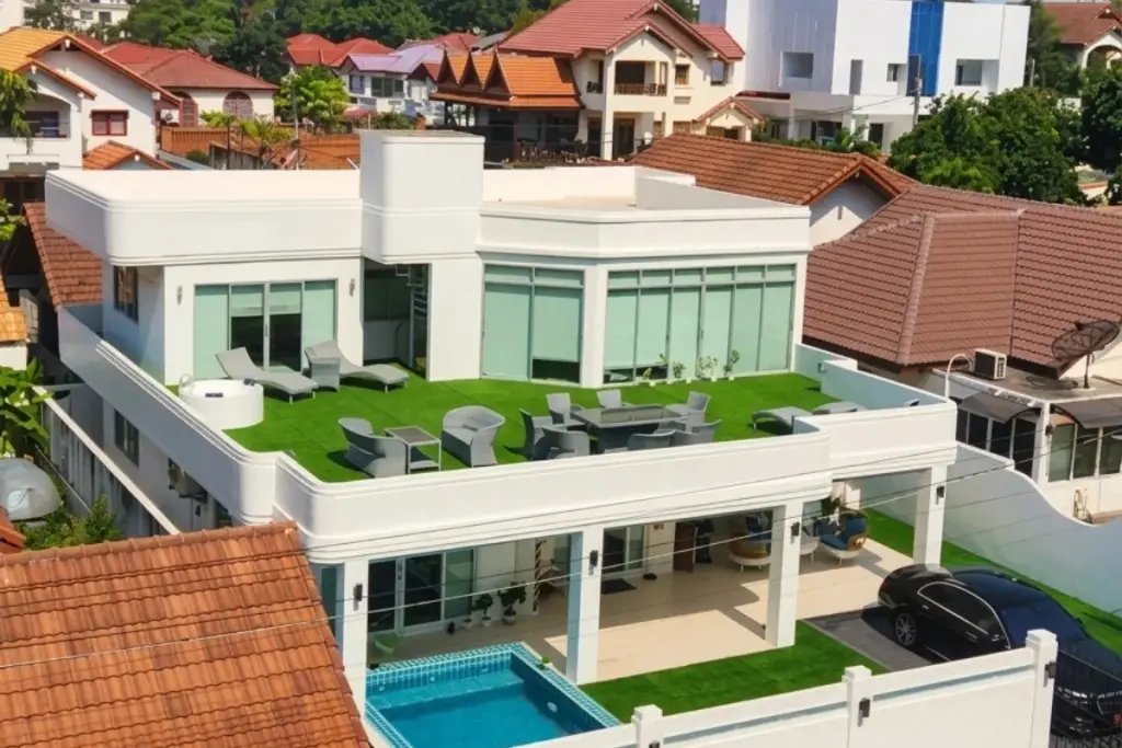 5 Bedroom House for Rent at Casa Jomtien aerial view showing rooftop terrace, private pool, and green lawn