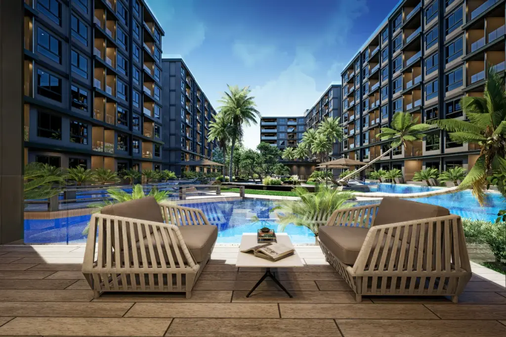 3 Bedroom Condo for Sale at Zenith 2 poolside lounge chairs overlooking resort-style swimming pool and palm trees